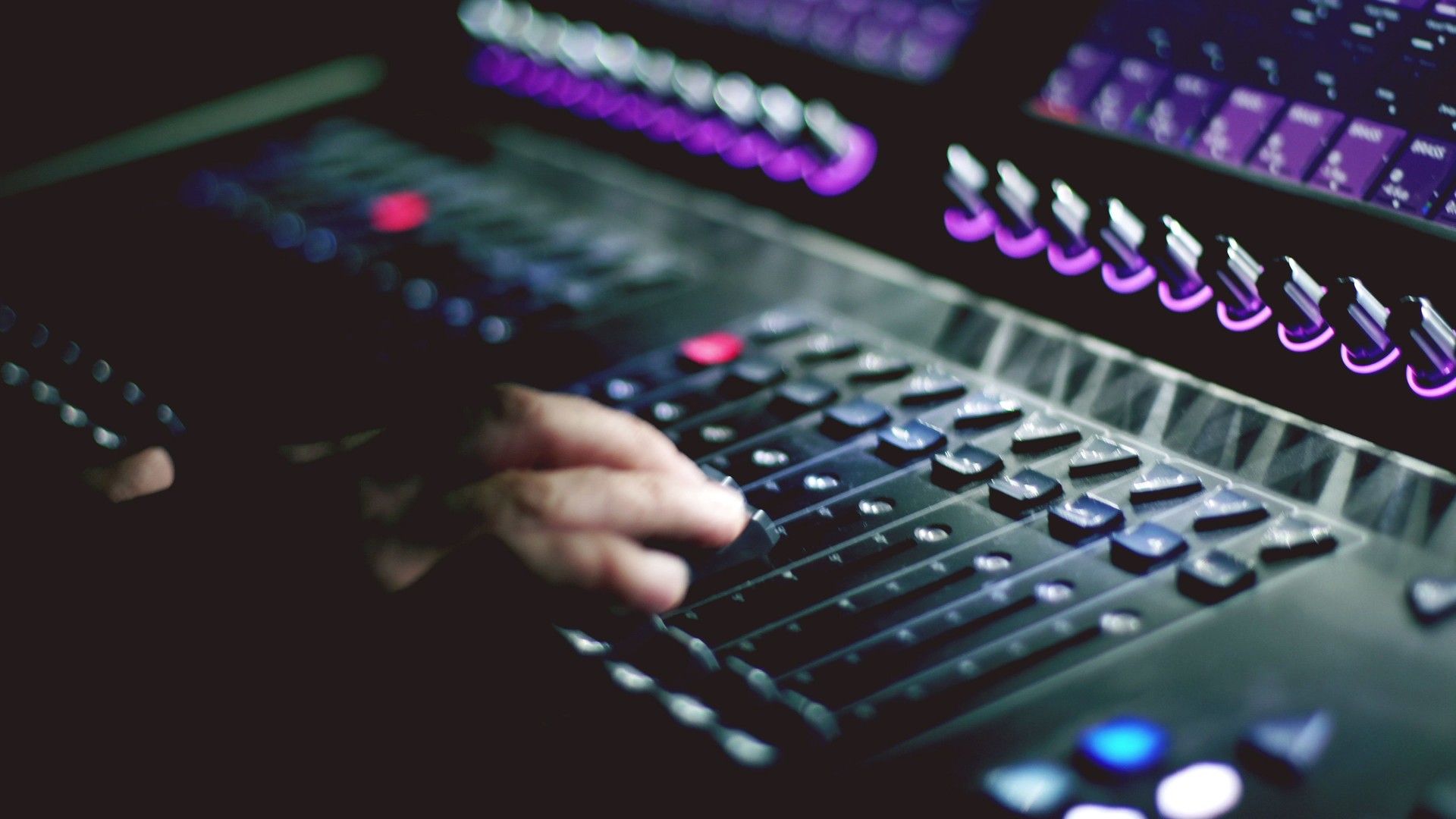 Man working on sound mixer in the club