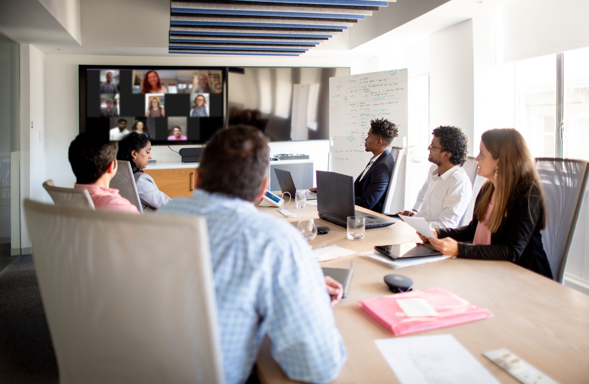 Businesspeople having a video conference in an office boardroom