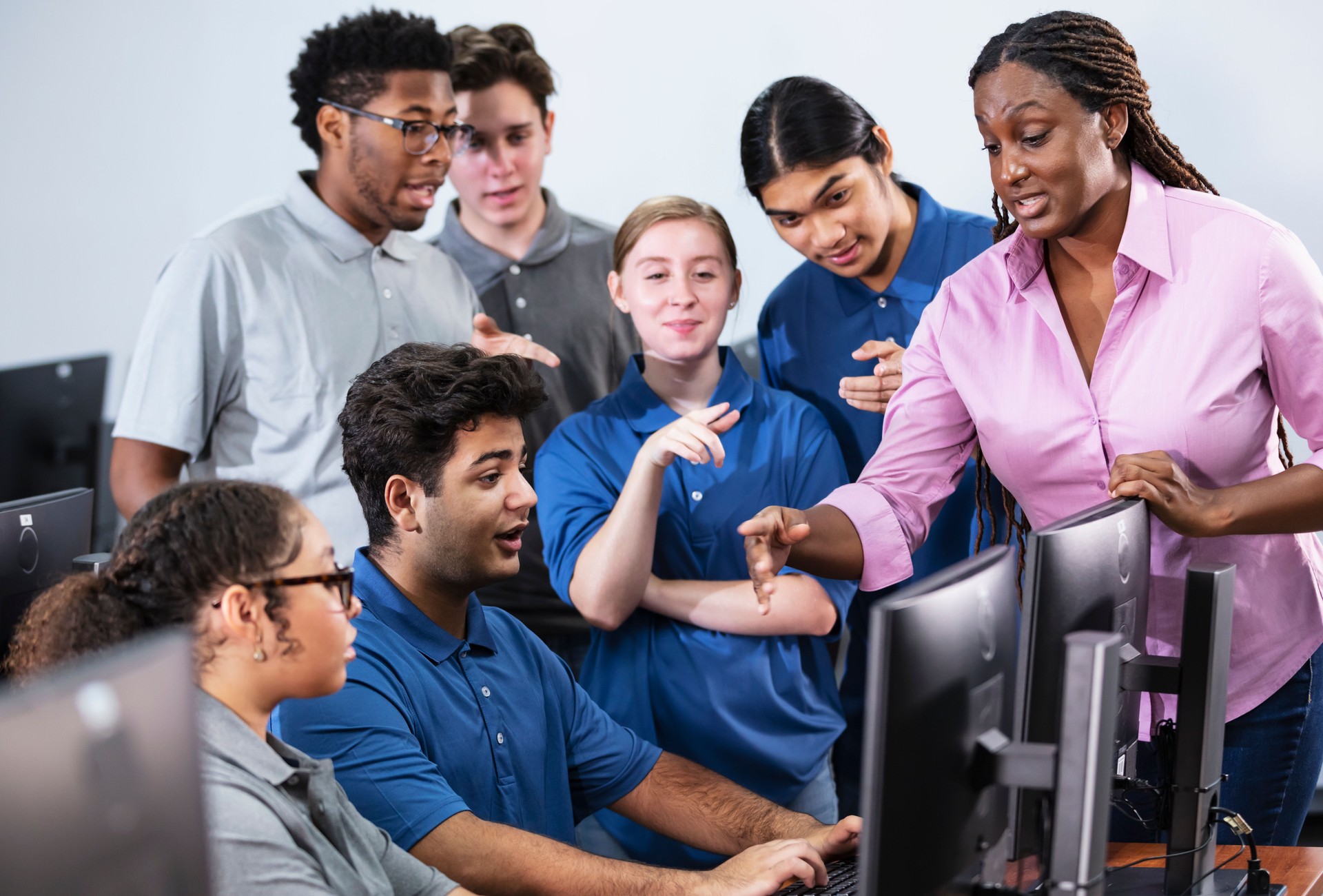 High school students and teacher in computer lab